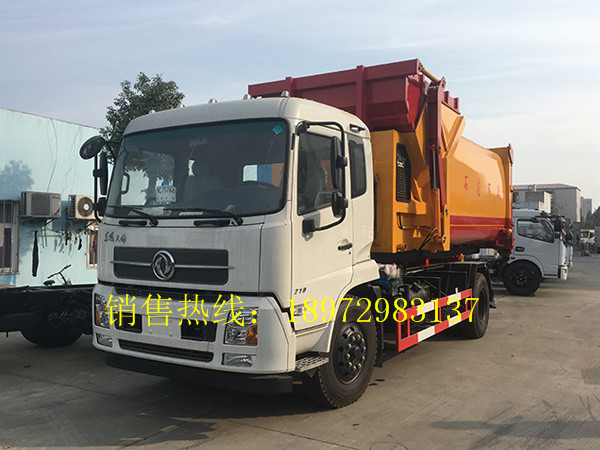 东风天锦勾臂式带移动压缩箱钩臂车